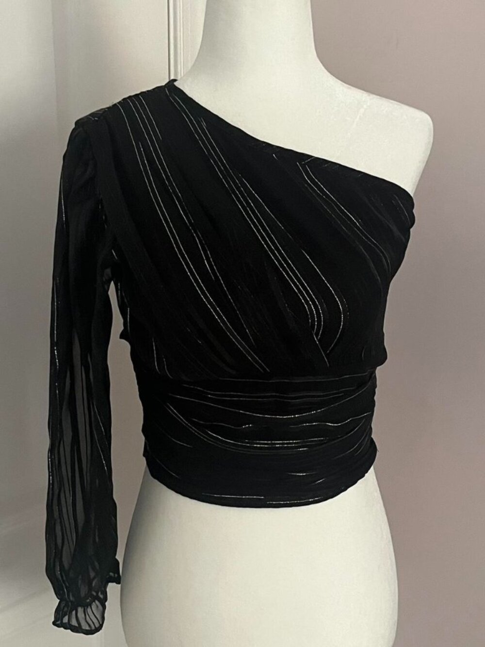 black one shoulder top with cute bow tie detail on the back